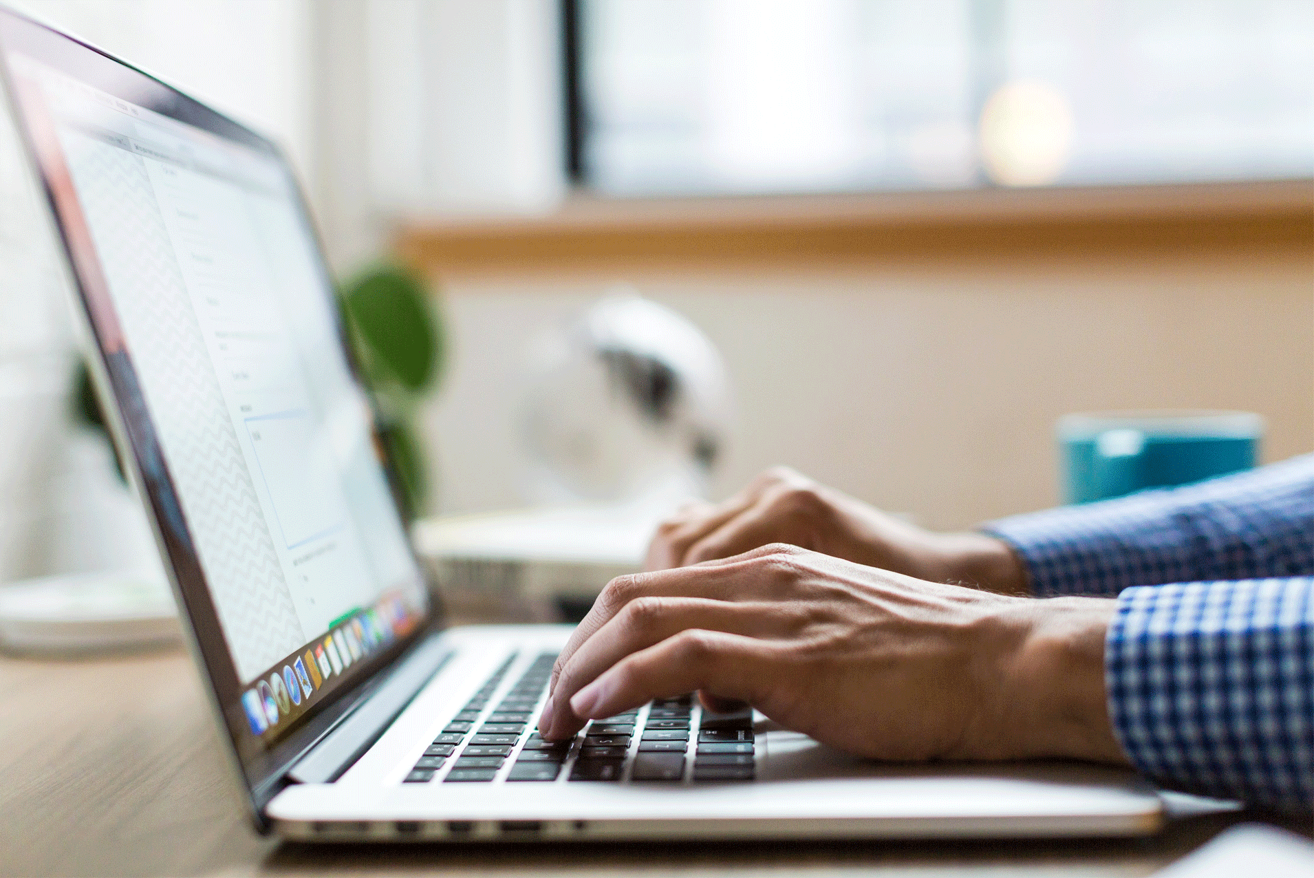 Typing on a laptop